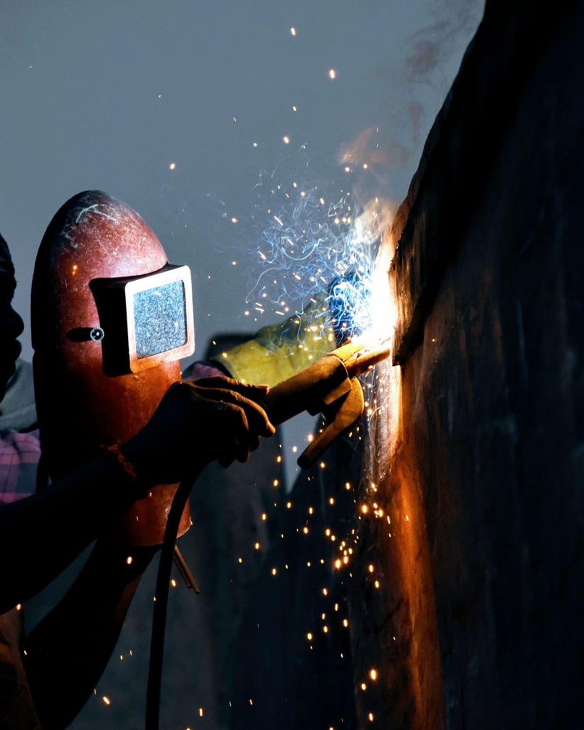 Welder joining a steel frame